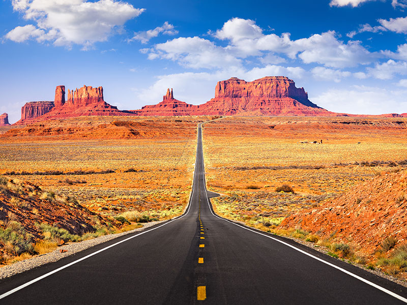 Picture of open road leading to Arizona mountains