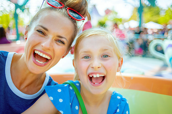 Smiling mother and daughter having fun